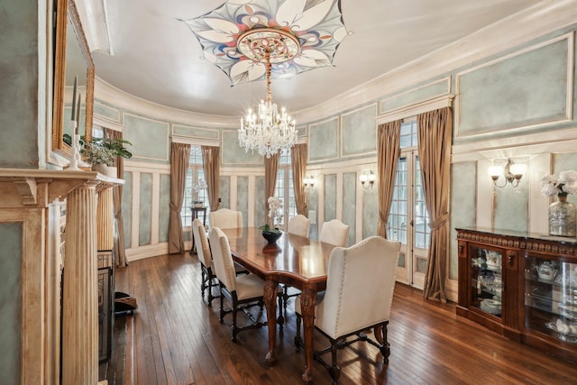 dining area featuring an inviting chandelier and dark hardwood / wood-style floors