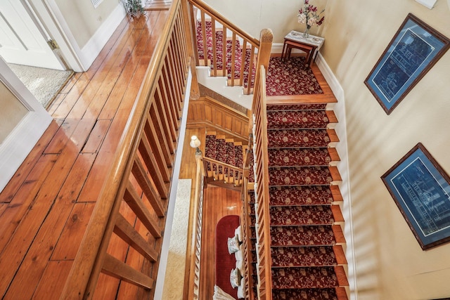 staircase featuring a towering ceiling