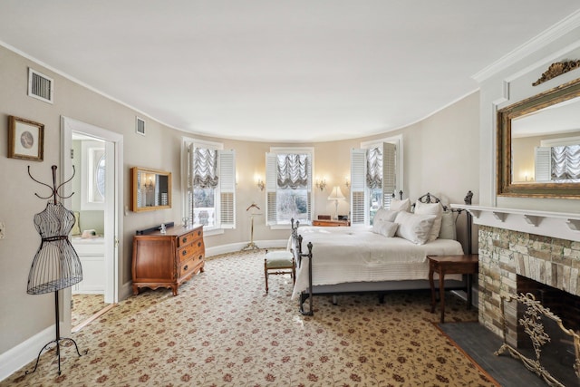 bedroom featuring ornamental molding and a fireplace