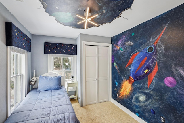 carpeted bedroom featuring a closet