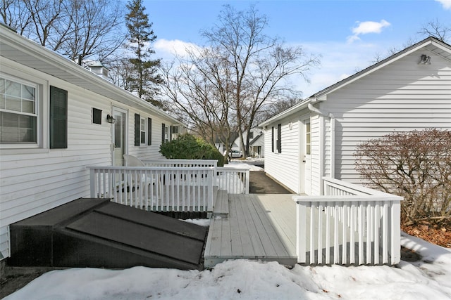 view of snow covered deck