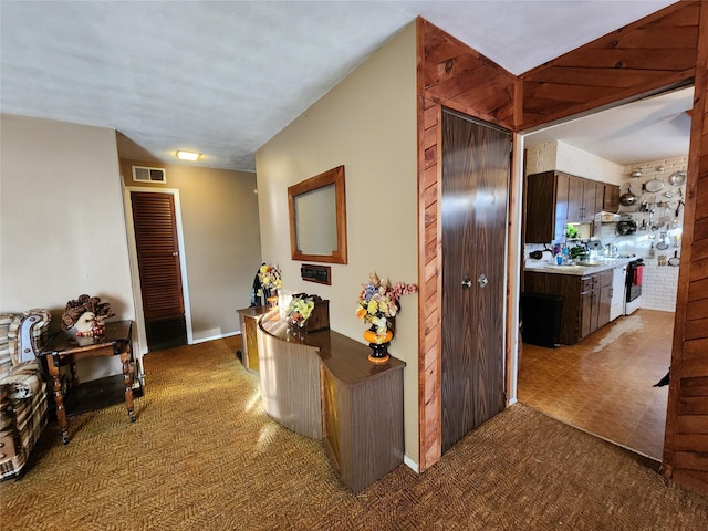 corridor featuring carpet flooring