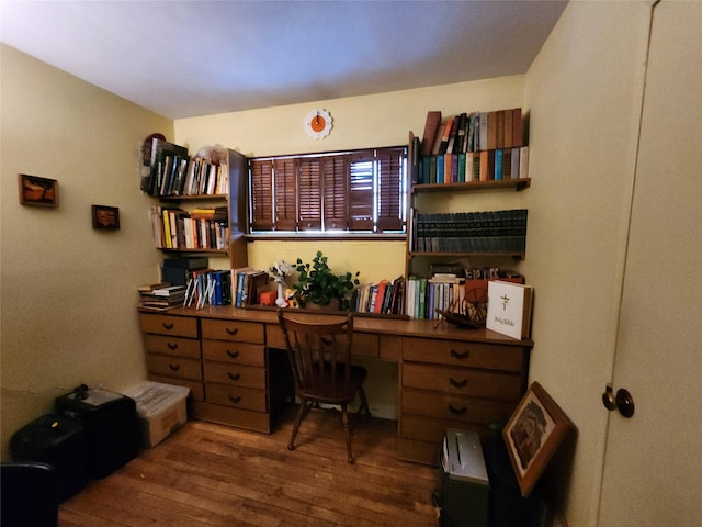 home office with dark hardwood / wood-style floors