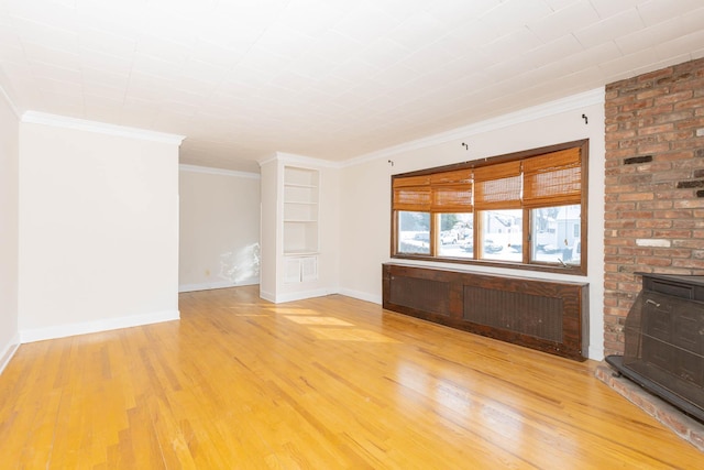 unfurnished living room featuring wood-type flooring, built in shelves, and ornamental molding