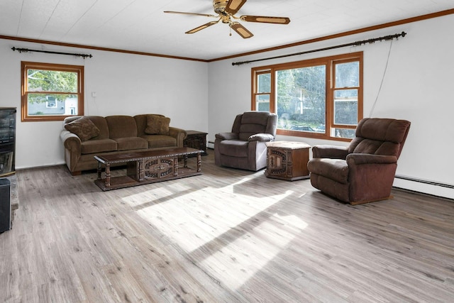 living room featuring ceiling fan, a wealth of natural light, light hardwood / wood-style flooring, and ornamental molding