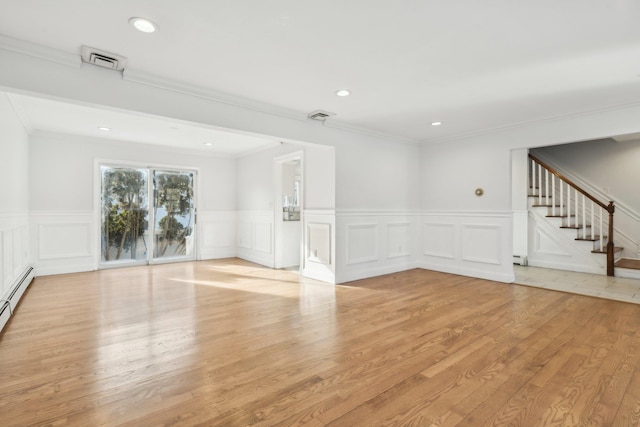 unfurnished room with crown molding and light wood-type flooring