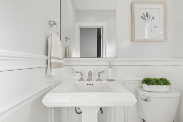 bathroom featuring sink and toilet