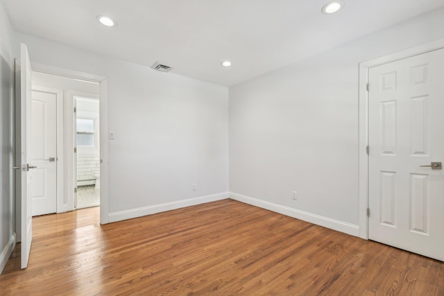 empty room featuring hardwood / wood-style floors