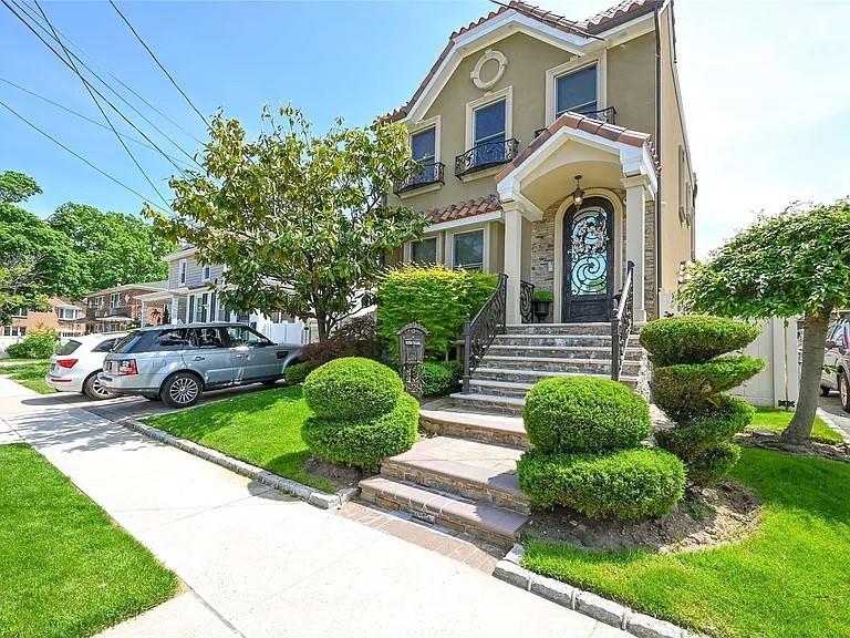 150-28 19th Ave, Whitestone, NY 11357 - view of front of property with a front yard