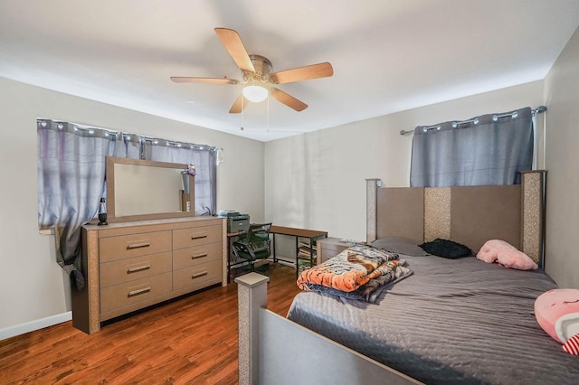 bedroom featuring ceiling fan and dark hardwood / wood-style flooring