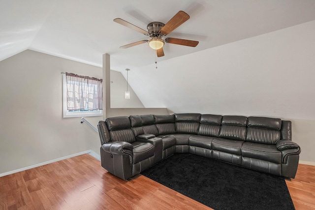 living room featuring vaulted ceiling, ceiling fan, and light hardwood / wood-style floors