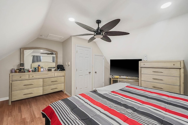 bedroom featuring lofted ceiling, ceiling fan, and light hardwood / wood-style floors