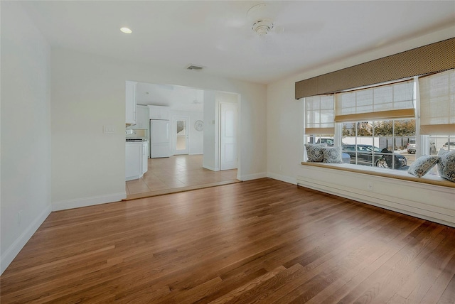 spare room with light hardwood / wood-style floors