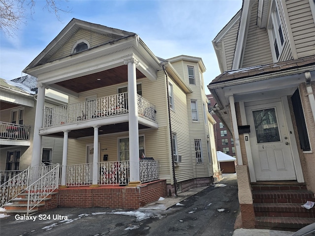 view of front of house with cooling unit and covered porch