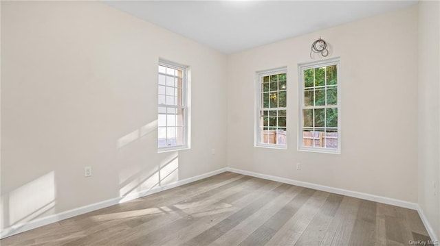 unfurnished room featuring light wood-type flooring