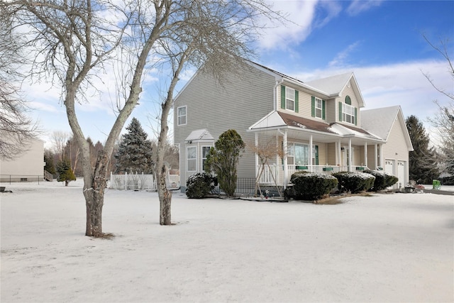 view of front of property featuring a porch and a garage