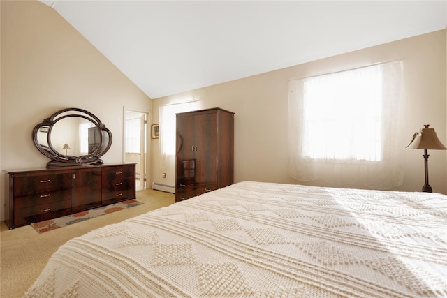 bedroom with vaulted ceiling, a baseboard heating unit, and light carpet