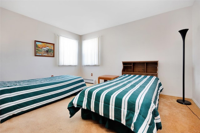 bedroom with a baseboard radiator and light carpet