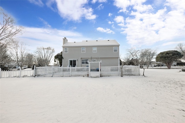 view of snow covered house