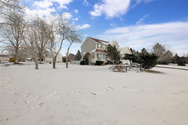 view of yard layered in snow