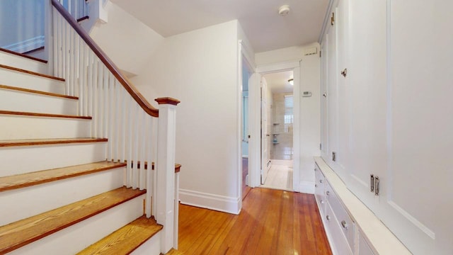 stairway featuring hardwood / wood-style floors