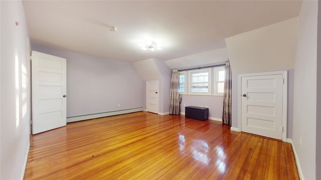 bonus room featuring hardwood / wood-style flooring and baseboard heating