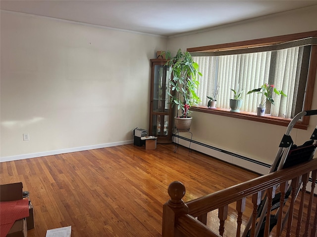 interior space featuring hardwood / wood-style flooring and ornamental molding