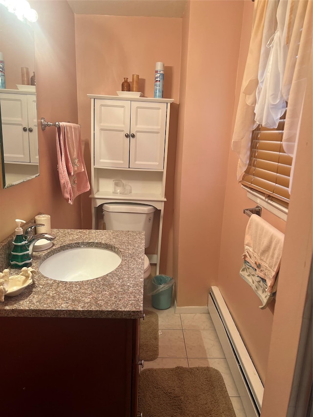 bathroom with a baseboard radiator, toilet, tile patterned floors, and vanity