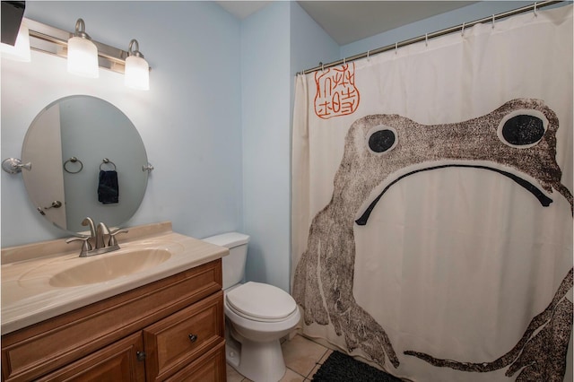 full bathroom featuring tile patterned floors, toilet, and vanity