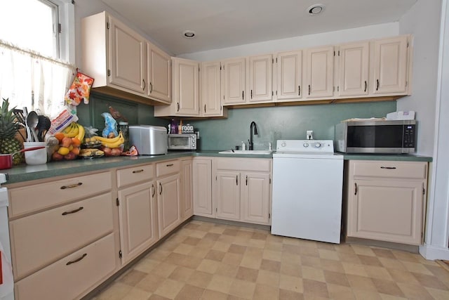 kitchen with sink and washer / dryer