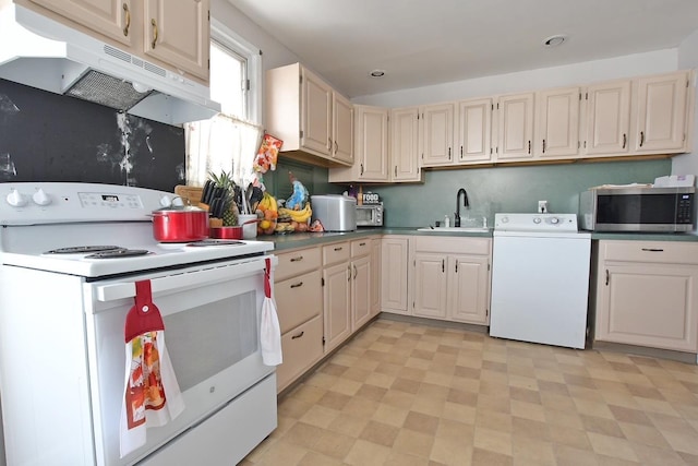 kitchen featuring white range with electric cooktop, washer / clothes dryer, and sink