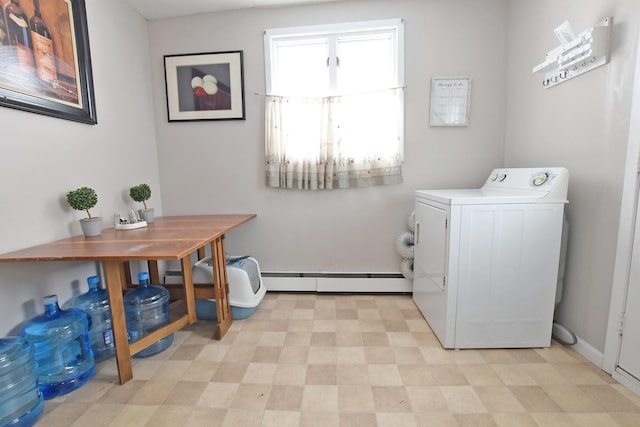 laundry room featuring baseboard heating and washer / dryer