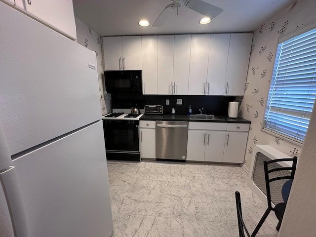 kitchen with dishwasher, sink, white cabinets, range with gas cooktop, and white fridge