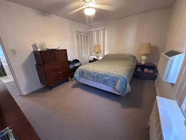 bedroom with a closet, ceiling fan, carpet flooring, and an AC wall unit