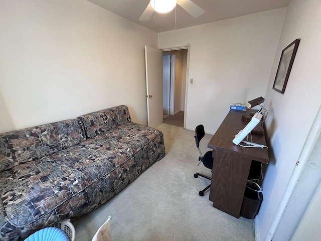 carpeted office featuring ceiling fan