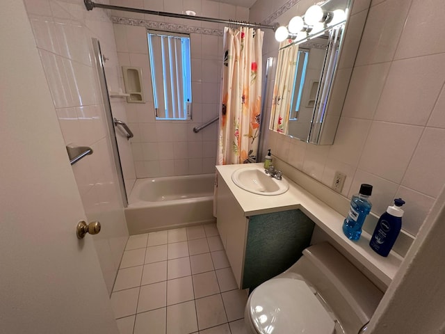 full bathroom featuring shower / bath combo, tile patterned floors, tile walls, toilet, and vanity