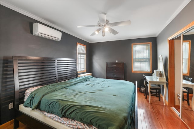 bedroom featuring multiple windows, ornamental molding, an AC wall unit, and ceiling fan