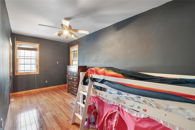 bedroom featuring hardwood / wood-style flooring and ceiling fan