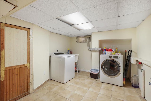 washroom featuring sink and washing machine and clothes dryer