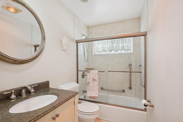 full bathroom featuring vanity, toilet, and enclosed tub / shower combo