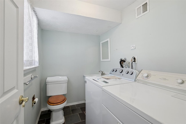 laundry area featuring independent washer and dryer