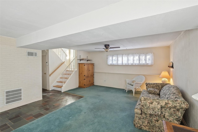 living area with ceiling fan and dark carpet