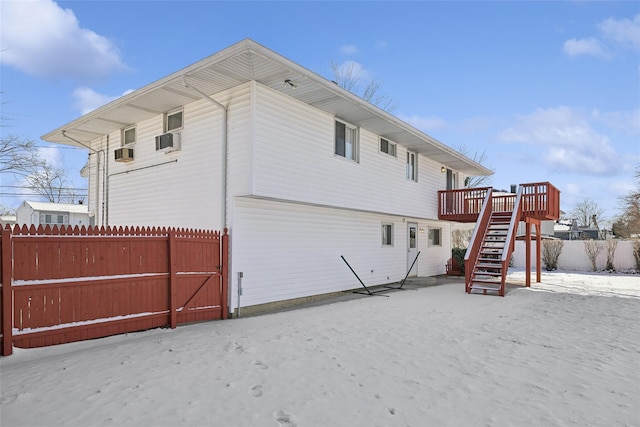 back of property featuring a wooden deck