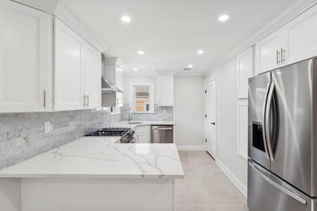 kitchen featuring white cabinetry, stainless steel appliances, and light stone countertops