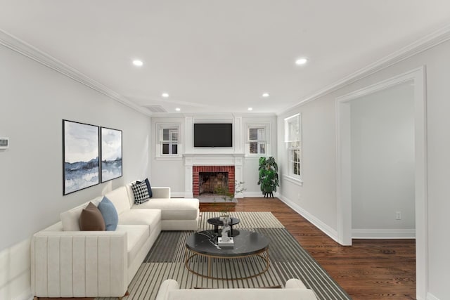 living room featuring ornamental molding, dark hardwood / wood-style floors, and a fireplace