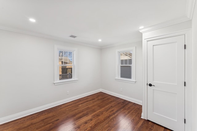 unfurnished room with crown molding and dark wood-type flooring