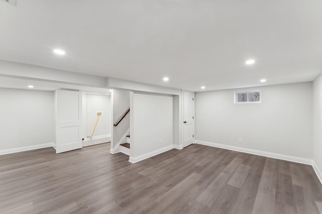 basement with hardwood / wood-style flooring