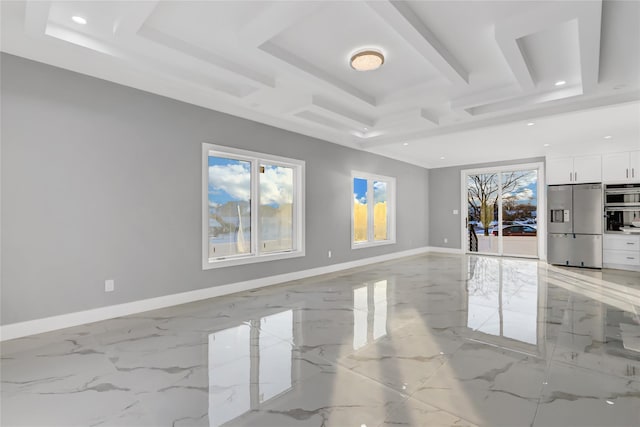 unfurnished living room featuring a tray ceiling