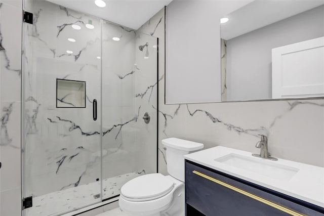 bathroom featuring toilet, tasteful backsplash, tile walls, vanity, and a shower with door