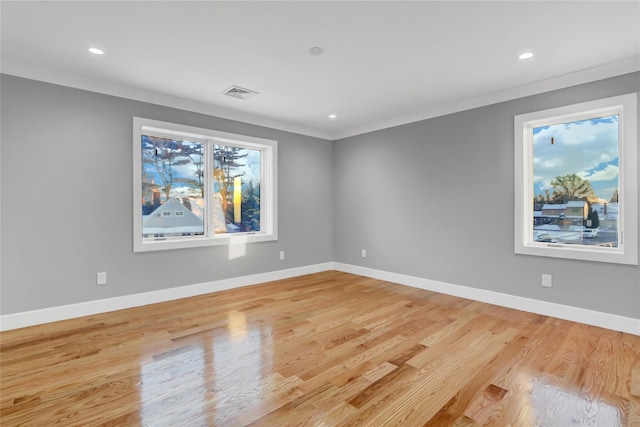 unfurnished room featuring light hardwood / wood-style flooring and ornamental molding